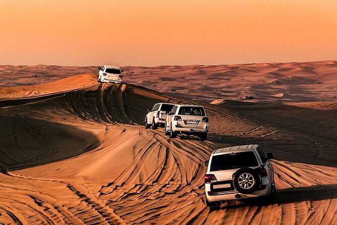 Premium Desert Safari with Dinner, Dunes and Ten Shows (VIP) - Luxury SUV pickup to Sahara desert drive in high red dunes