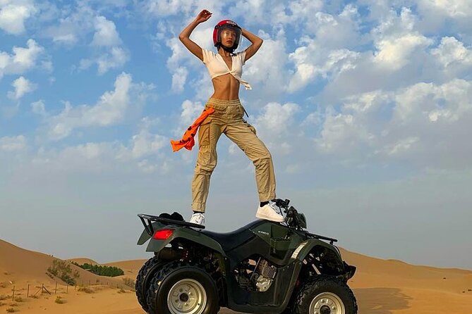 Premium Evening Desert Safari with Quad Bike, Camel Ride and BBQ Dinner - Camel farms, camel riding, and sand boarding at camp
