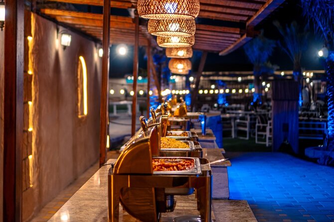 Premium Red Dune Safari with Camel Ride and BBQ in Arabian camp - Camel ride and sandboarding, hands-on desert fun