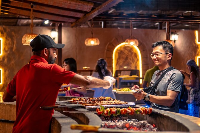 Premium Red Dune Safari with Camel Ride and BBQ in Arabian camp - Small group size, guide help, and the pace you should expect