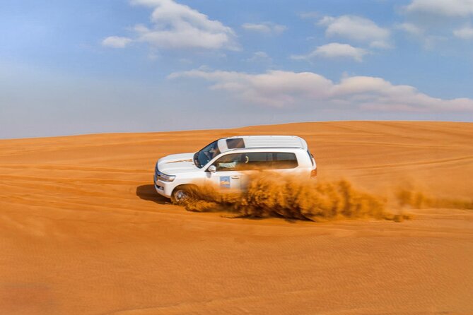 Premium Red Dune Safari with Camel Ride and BBQ in Arabian camp - The sunset dune stop, why it’s more than a photo break