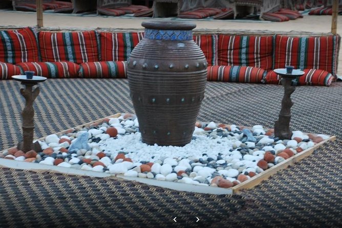 Private Desert Safari Red Dune with BBQ, Sand Boarding and Camel Ride - BBQ Dinner With Tanoura, Belly Dancing, and Fire Show