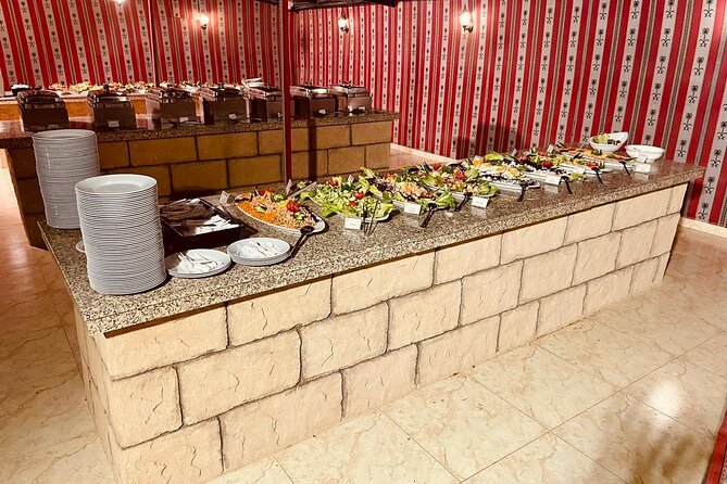 Private Sunset Desert Safari:SandSurfing, Camel Ride & BBQ dinner - Camel ride and falcon photo, a quick but classic change of pace