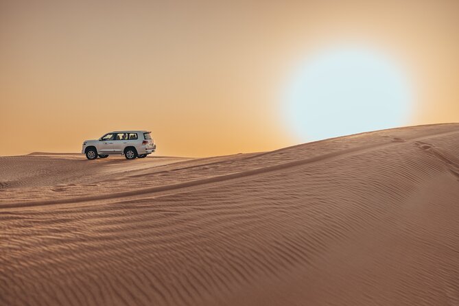 Private Sunset Desert Safari:SandSurfing, Camel Ride & BBQ dinner - 30 minutes of dune bashing and the sunset photo stop