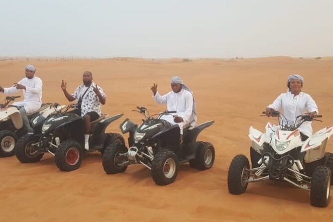 Quad Bike Dubai Desert Safari with BBQ Dinner Sandboard and Show - Lahbab Red Dunes: ATV Quad Bike, Dune Bashing, and Sunset Photos