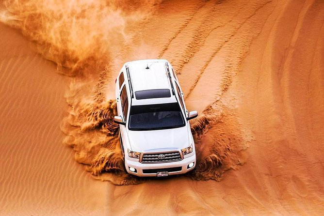 Red Dune 4x4 Desert Safari with Camel ride & BBQ Dinner - Live Shows at the Camp: Belly Dance, Fire, and Tanura