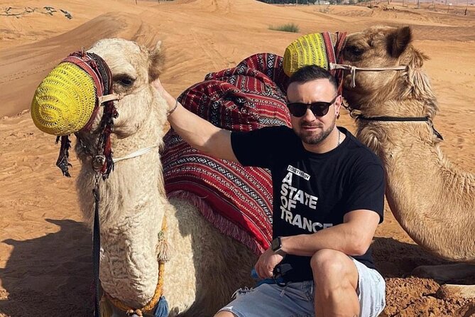 Red Dune Desert Safari Tour with Camel Ride & BBQ Experience - BBQ Buffet Dinner and the Live Tanoura, Belly Dance, Fire Show