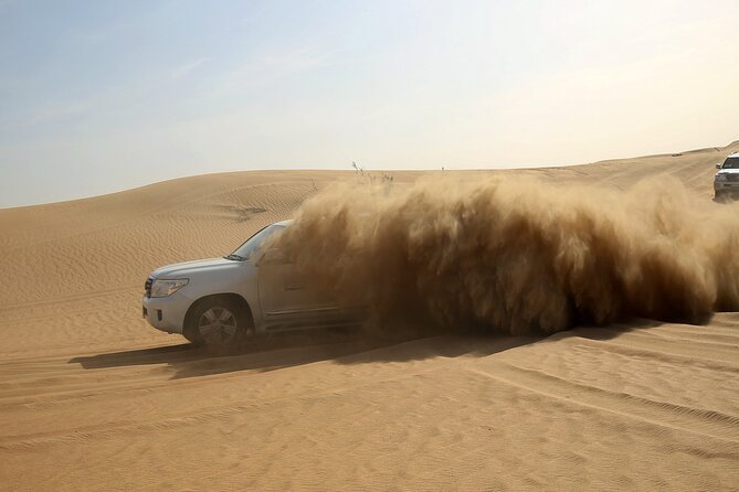 Red Dune Evening Desert Safari with Sandbashing and BBQ Dinner - Sandbashing (30 to 45 minutes) and sandboarding: the core of the thrill