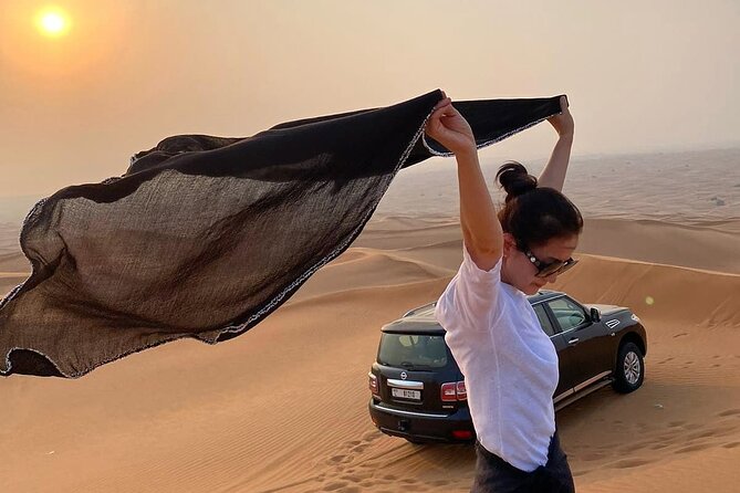 Red Dunes Desert Safari Dubai with Dinner Buffet, Show & Transfer - Dune bashing in the red sand: the main event