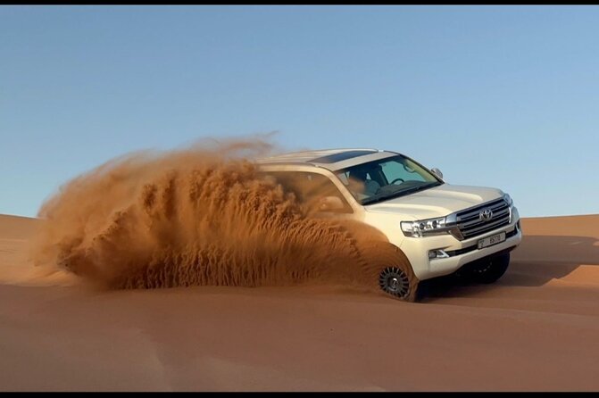 Red Dunes Desert Safari Dubai with Dinner Buffet, Show & Transfer - Camel ride and sand boarding at the camp: fun, but keep it realistic