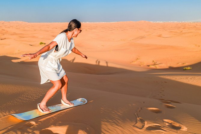 Red Dunes Desert Safari, Sand Board, Camel Ride with BBQ Dinner - The ride out of Dubai: small group, long-change-of-scene energy