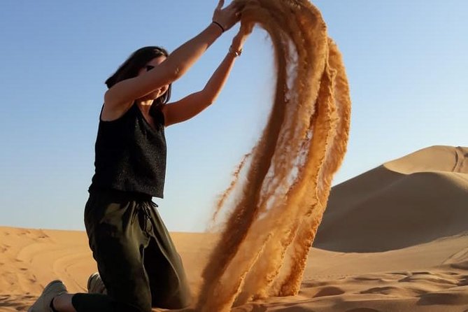 Red Dunes Safari with Sandboarding & Camel Ride from Ras Al Khayma - Live entertainment: Tanura, belly dancing, and fire shows
