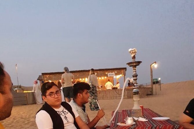 Red Sand Tourism desert safari with premium camp - The Lahbab sunset stop: photos plus sandboarding