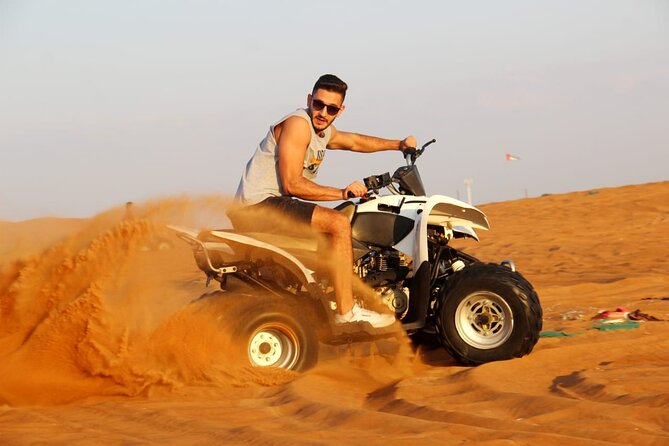 Sunrise Desert safari With Quad bike ride Sandboard & Camel ride - Dune bashing and sandboarding: adrenaline, then controlled fun