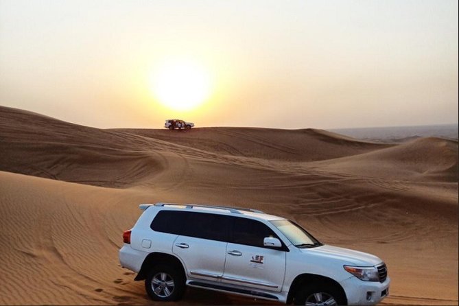 Sunset Desert Safari With BBQ Dinner, Camel Ride, Belly Dancing from Dubai - Belly Dance, Tanura, Fire Show, and the Photo-Friendly Camp Energy