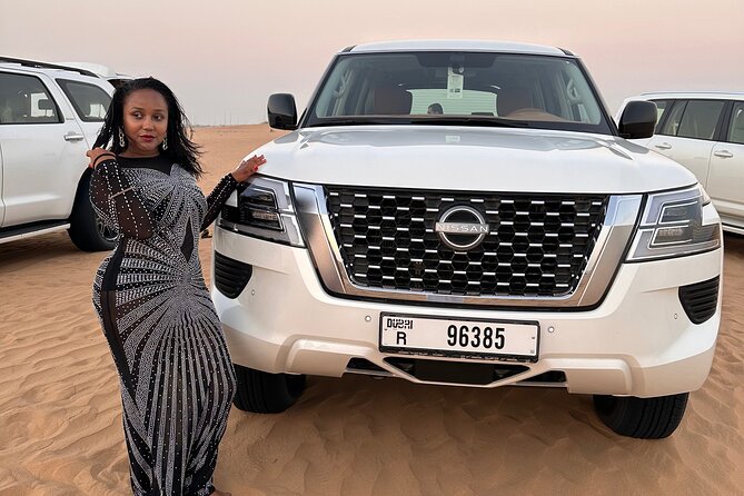 Sunset Desert safari with Camel Ride Sand Board & BBQ Dinner - Lahbab red dunes: dune bashing and sandboarding you can feel