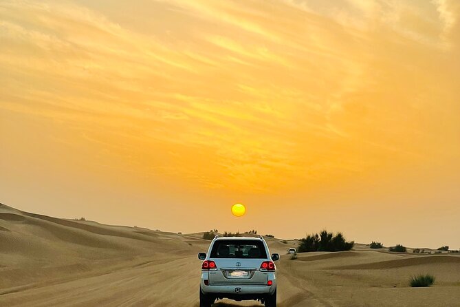 Sunset Safari with BBQ Dune Drive Camel Ride & Dune Buggy option - From Desert Stops to the Modern Bedouin Camp