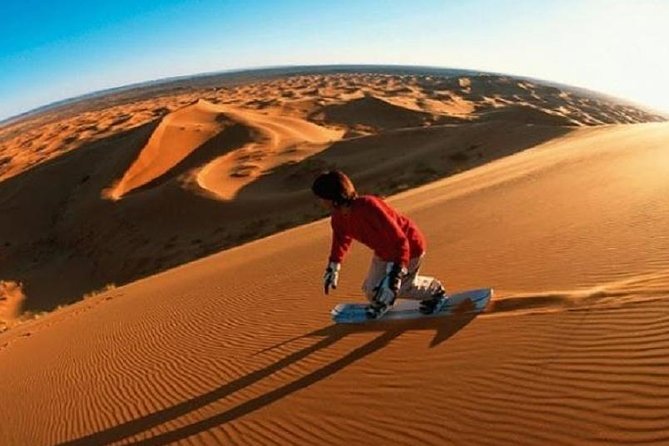 Thrilling Morning Red Dune Desert Safari with Camel Ride in Dubai - Sandboarding: the fun follow-up after the bumps